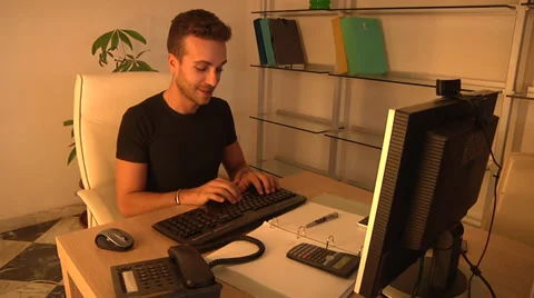 Smiling young man working on PC with webcam. Stock Footage 31611208