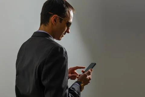 Smiling Young Middle Eastern Man With smartphone Stock Photos