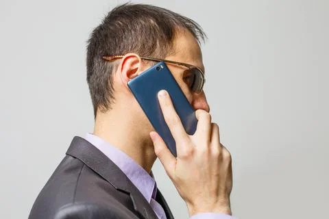 Smiling Young Middle Eastern Man With smartphone Stock Photos
