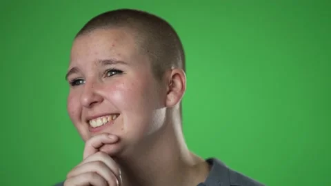 Smiling young non binary, gender fluid woman 20s look around think dream lost in Stock Footage 221846705