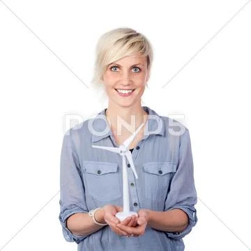 Smiling young woman holding wind turbine Stock Photos