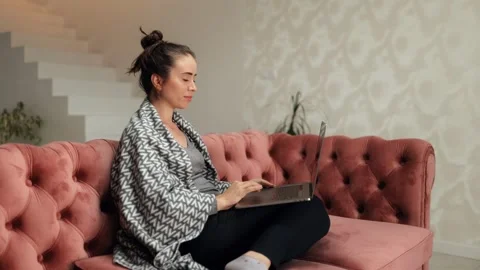Smiling young woman using apps, searching internet, e-learning, studying Stock Footage 252466890