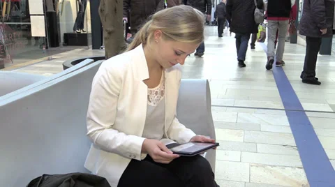 Smiling young woman using a tablet Stock Footage 33736566