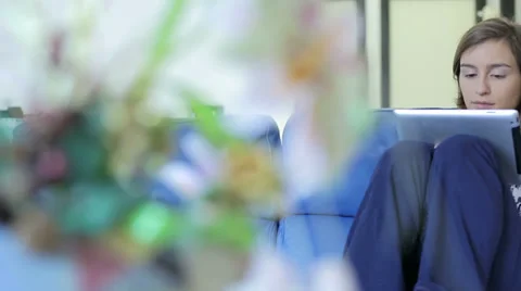 Smiling young woman using tablet computer at home at morning Stock Footage 34281740