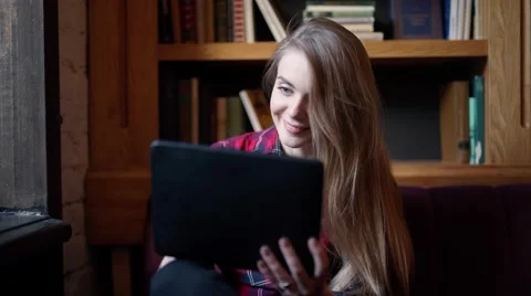 Smiling young women using digital tablet in the office Stock Footage 58190559