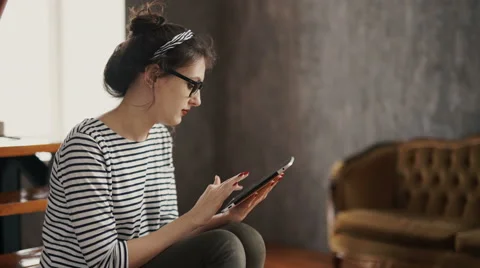 Smiling young women using digital tablet in the office Stock Footage 62025219