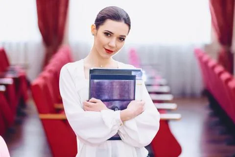 Smilingcute girl with documents Stock Photos
