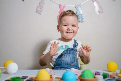 Smilling boy making bunny for easter Stock Photos