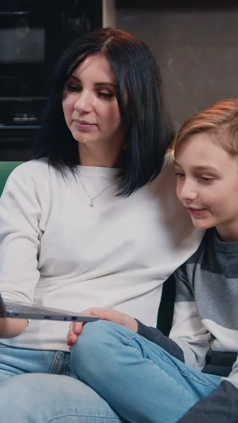 Smilling mom and son having video call with father, online communication. Family Stock Footage 331215186