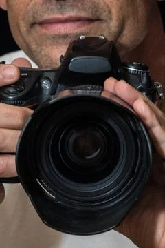 Smirking expression behind the camera. Stock Photos