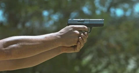 Smith and Wesson SD40VE 40 Cal Hand Gun shooting Outside Video stock 76105864