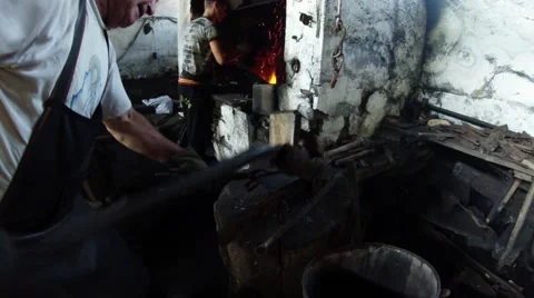 Smith Bends a Detail Shovel in the Smithy in the Carpathians Stock Footage 59761338