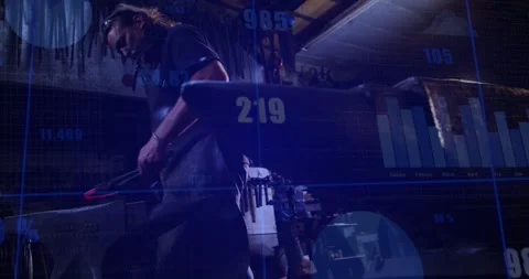 Smith in forge preparing metal, moving it, lifting hammer and shaping with Video stock 320651154