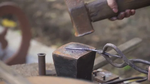 Smith forges nails Stock Footage 95766311