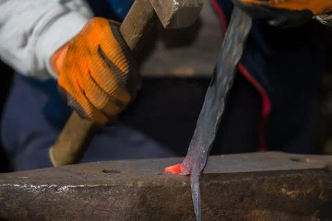 Smith forging hot iron Stock Photos