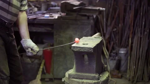 Smith forging red hot iron Stock Footage 48729530
