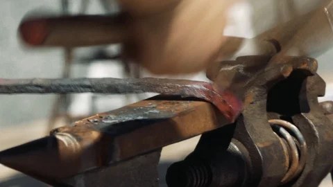 Smith forming red hot iron in hook on anvil. Blacksmith in forge beats hammer 스톡 동영상 110836433