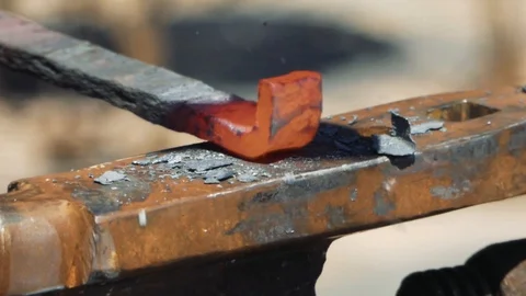 Smith forming red hot iron in hook on anvil. Blacksmith in forge beats hammer Stock Footage 110836464