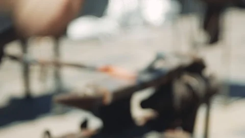 Smith forming red hot iron in hook on anvil. Blacksmith in forge beats hammer Stock Footage 111265664