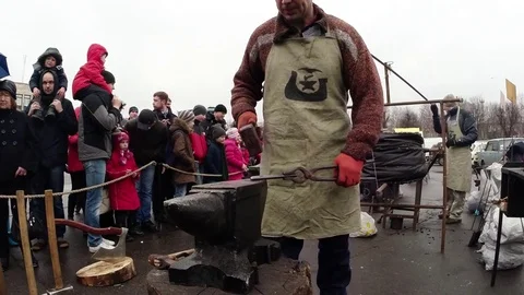 Smith With Hammer Handles Burning The Workpiece on the Anvil Stock Footage 74793227