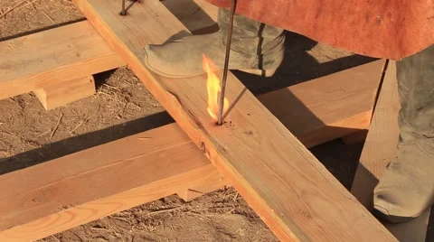 Smith Is Making A Hole With The Hot Iron Tool Stock Footage 65020736
