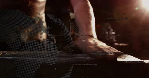 Smith placing palm on metal block, sliding hand and inspecting surface, with Stock Footage 328383855