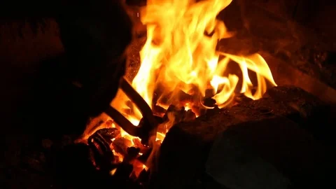 Smith puts the metal bar into forge furnace Video stock 72814159