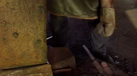 Smith Scores a Chisel Into the Machine in an Ancient Smithy in Ukraine Stock Footage 59762612