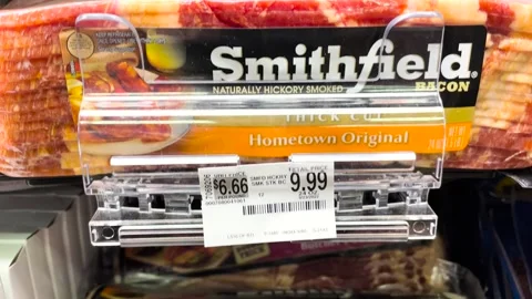Smithfield Bacon thick cut and prices in a retail store tilt down Stock Footage 175484068