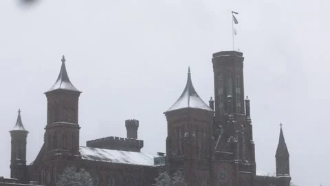 The Smithsonian Castle in the snow Stock Footage 147632273