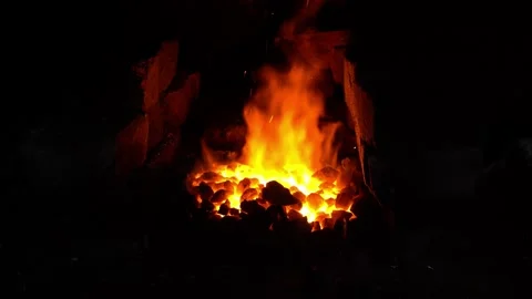 In the smithy, the coal is heated in a forge Stock Footage 152340480