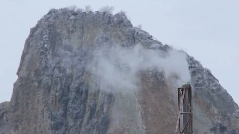 Smockestack under cliff Stock-Footage 96341970