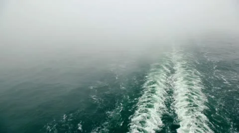 Smoke above froth trace on water surface after ship Stock Footage