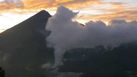 Smoke from the active Rinjani volcano at sunset, in Indonesia Stock Footage 221870466