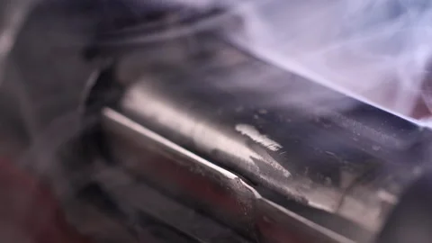 Smoke after the shot above the ejection port in close-up Stock Footage 305176203