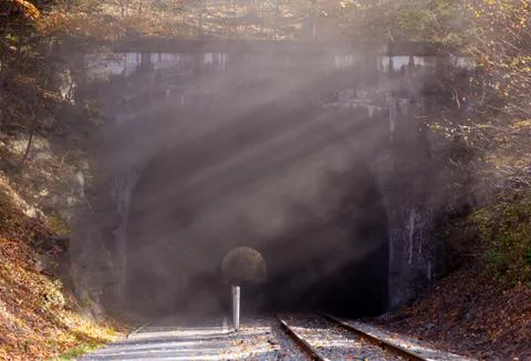 Smoke after train has left tunnel Stock Photos
