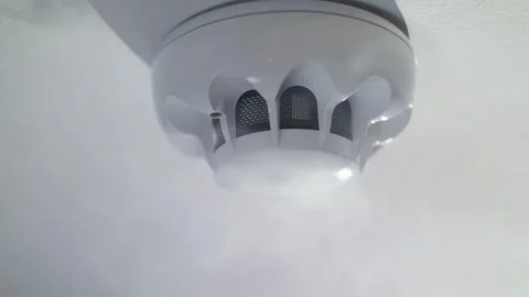 Smoke Alarm on Ceiling Surrounded by White Smoke Fire Safety Concept Vidéo 334563238