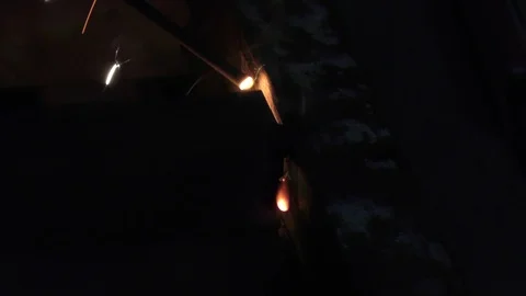The smoke and flash of light emerging from welding process on iron Stock Footage 112854725