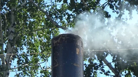 The smoke belching from the chimney Stock Footage 96051263