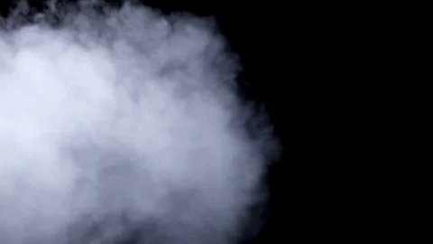 Smoke billowing over a black background. | Stock Video | Pond5