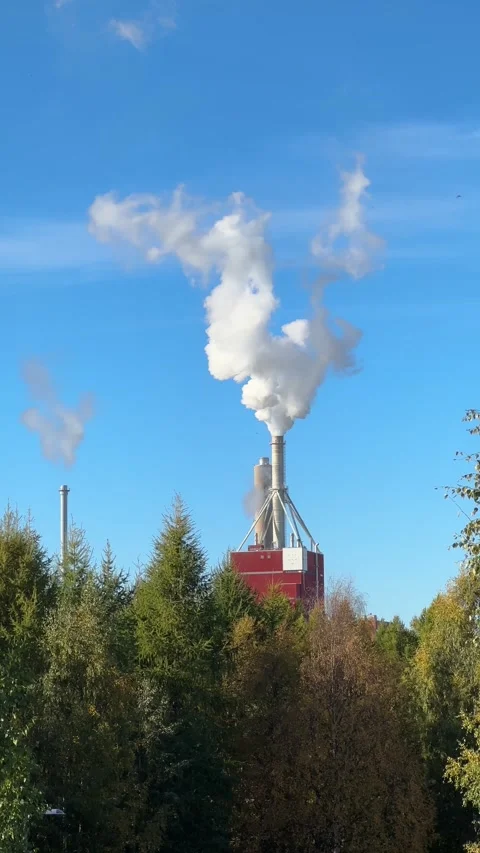Smoke billowing from a pulp and paper factory, Finland Stock Footage 286428958