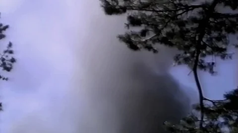 Smoke billows into the sky (mos) Stock Footage 79978456