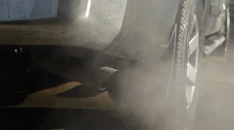 Smoke billows from tail pipe, pollution concept Stock Footage