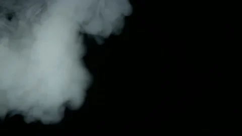 Smoke on a black background moves quickly from left to right Stock Footage 134903195
