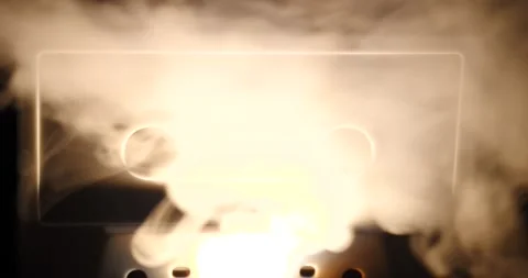 Smoke blasting cassette tape representing music or song Stock Footage 202733788