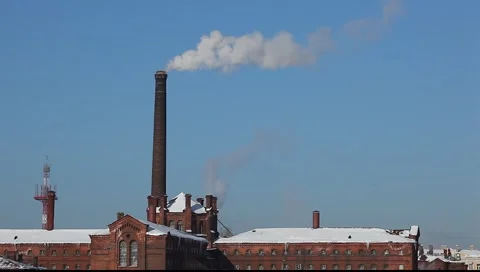 Smoke from the brick chimney, winter time, against fresh blue sky Видео 1776543