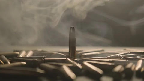 Smoke. The bullets are on the table. Stock Footage 199090245