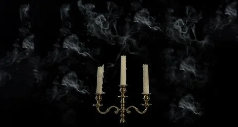 Smoke from a burning candle in candelabra on a black background, Stock Photos