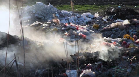 Smoke from burning trash at garbage dump  Stock Footage 36778977