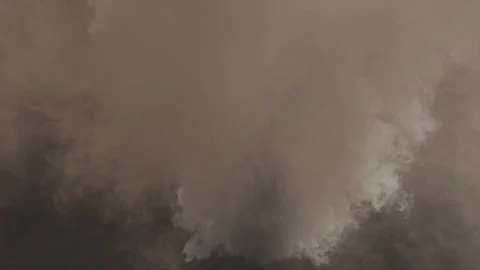 The smoke in the center of the frame flies at the viewer. Stock Footage 276486571